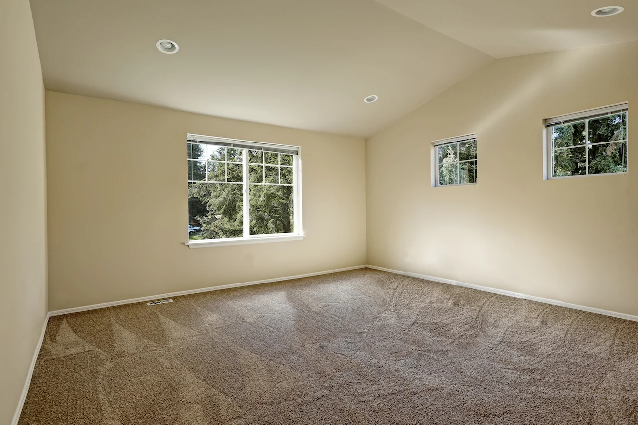 beige walls with brown carpet