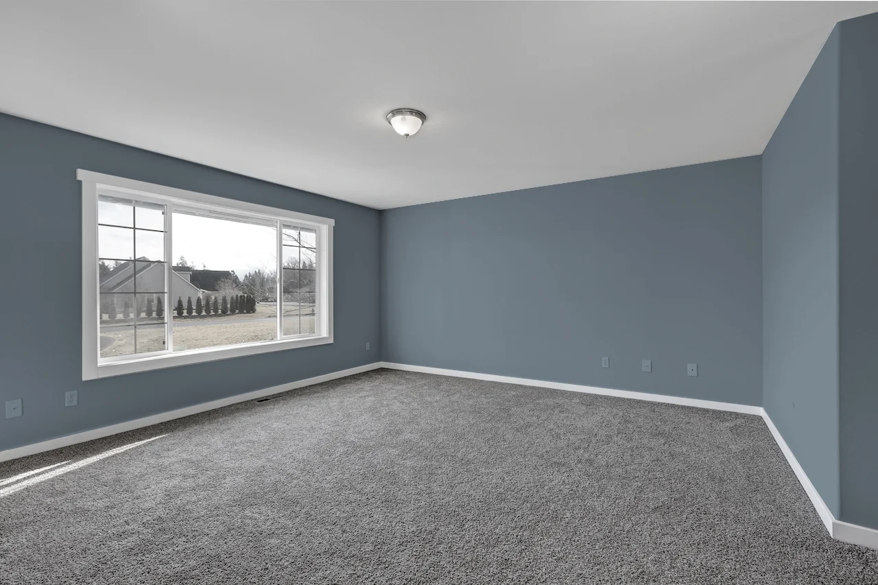 dusty blue wall with grey carpet