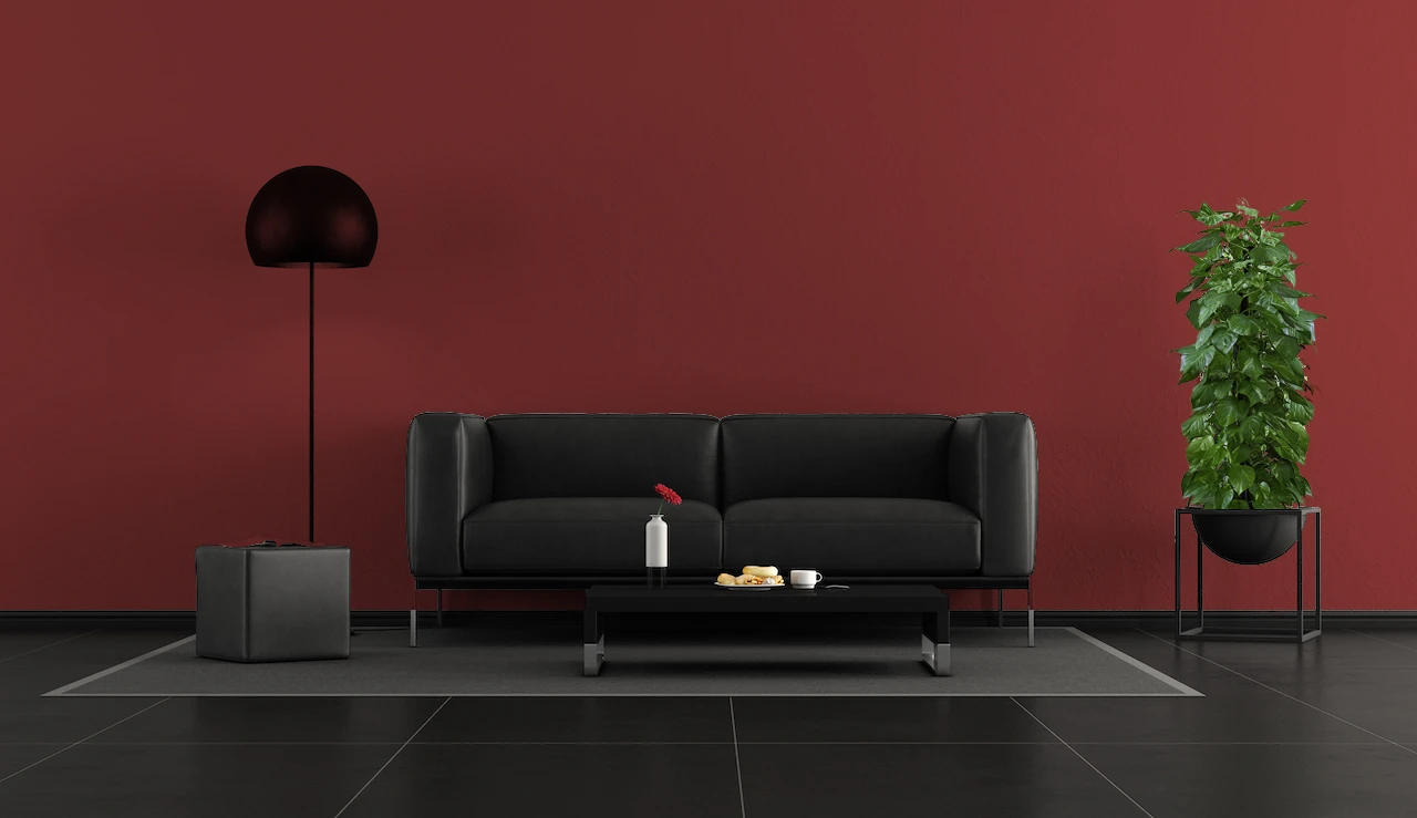 rich red walls with black furniture