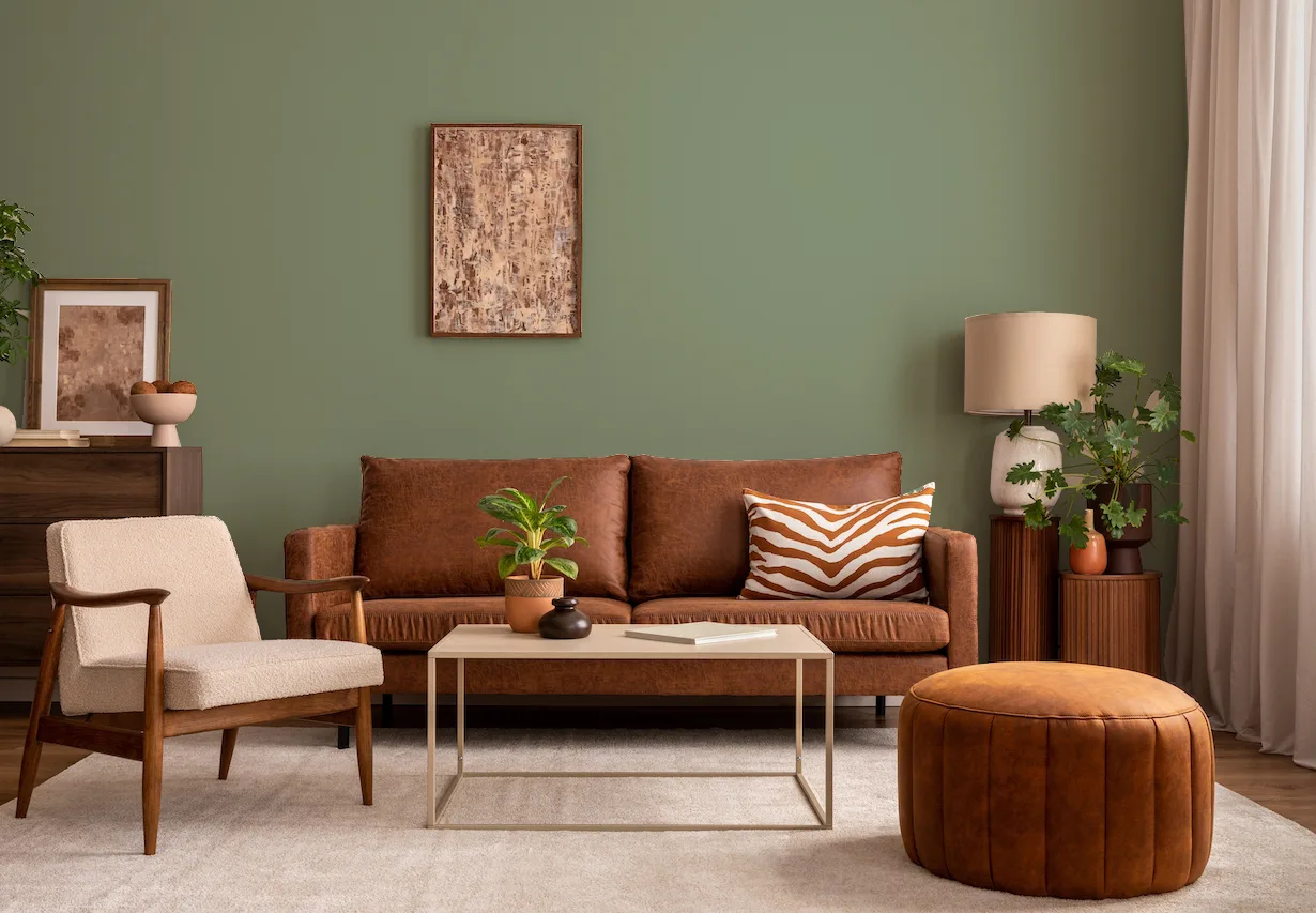 sage green walls with brown furniture