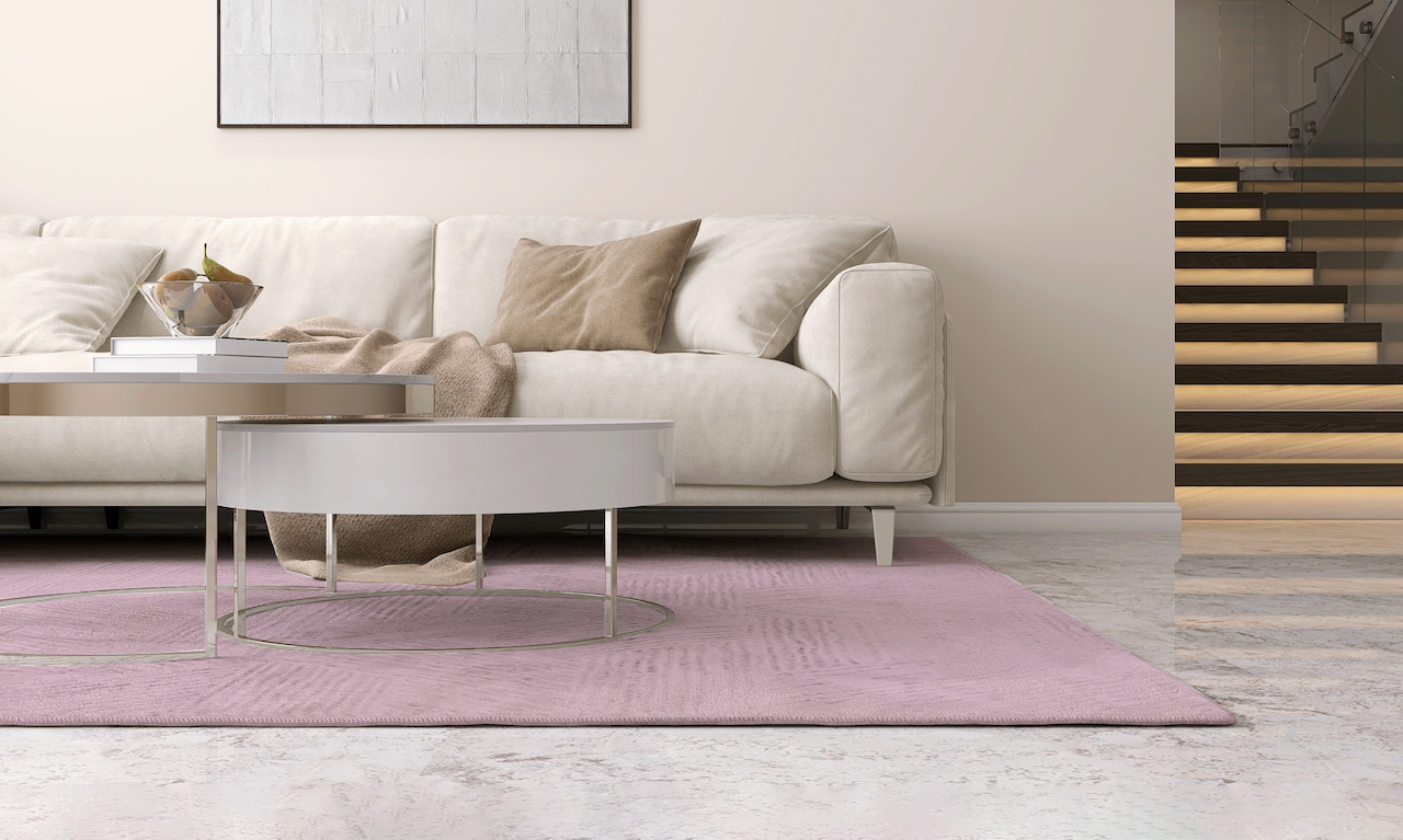 soft pink rug with cream couch