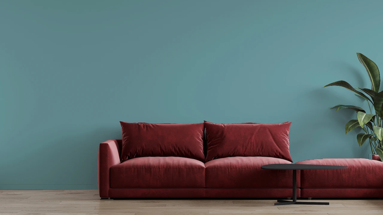aquamarine walls with burgundy couch